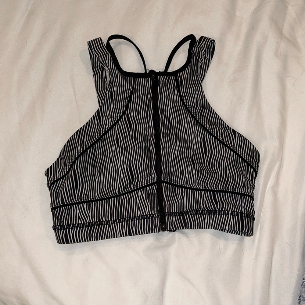 Black and white intricate back front zip sports bra